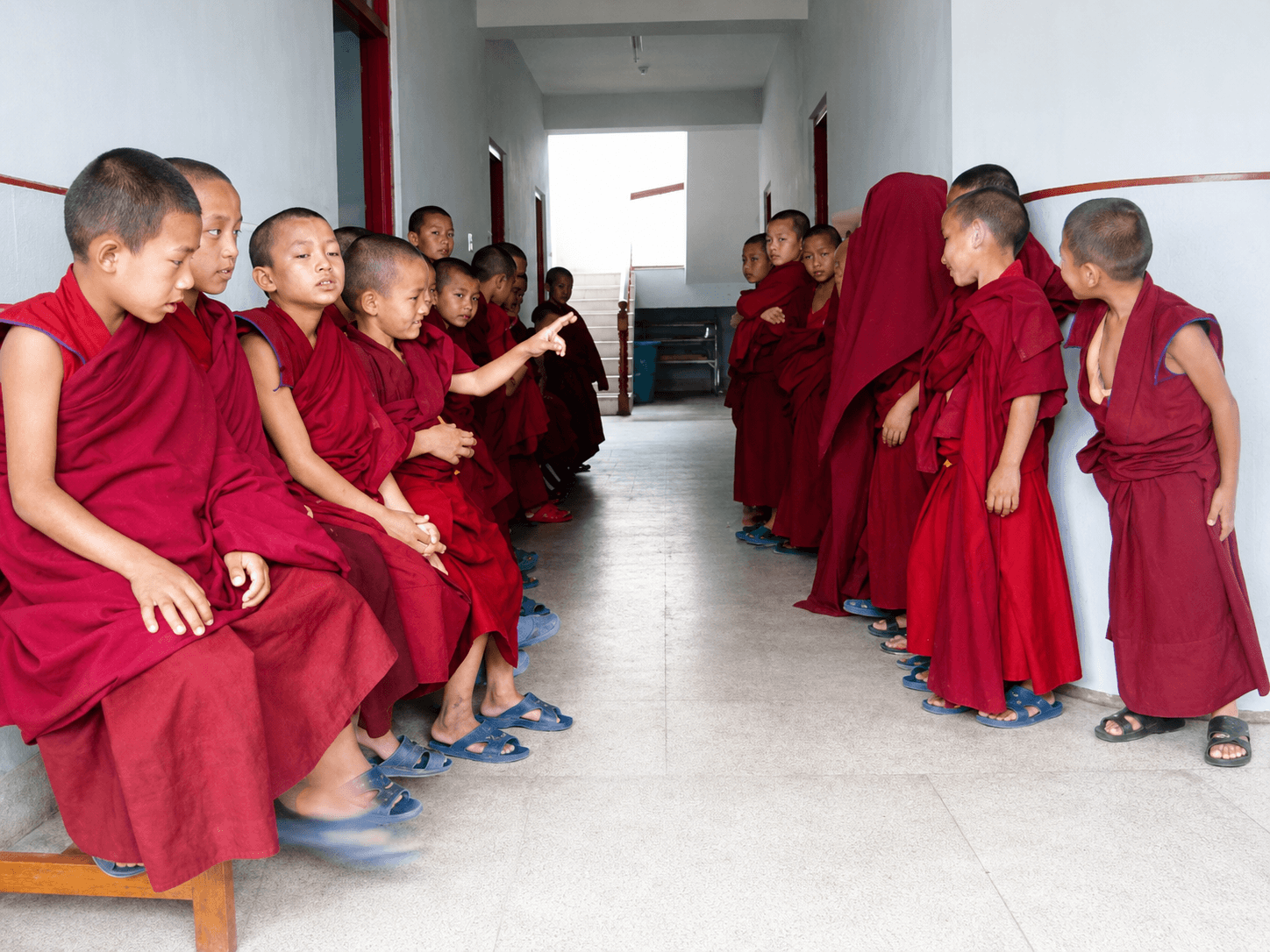 Monks lining up in the treatment room, Kopan Clinic